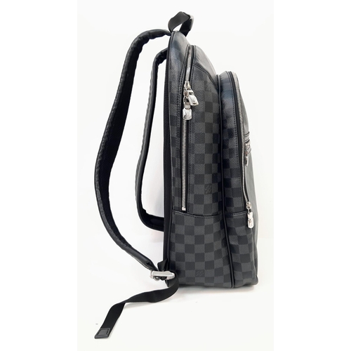 267 - A Louis Vuitton Damier Graphite Michael Backpack. Leather and canvas exterior with top handle, adjus... 