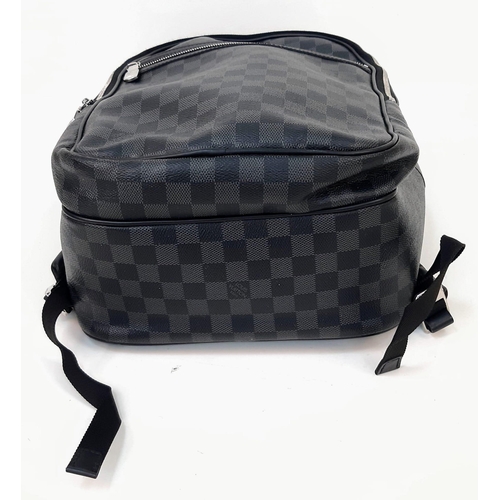 267 - A Louis Vuitton Damier Graphite Michael Backpack. Leather and canvas exterior with top handle, adjus... 