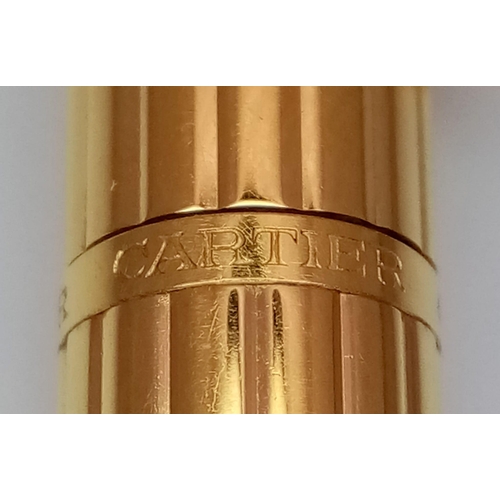 319 - A Cartier Santos Gold Plated Ballpoint Pen. In good condition and working order. Ref: 14893