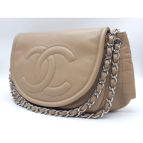 32 - A Chanel Taupe Half Moon Flap Bag. Caviar leather exterior with diamond quilting through the base an... 