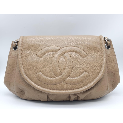 32 - A Chanel Taupe Half Moon Flap Bag. Caviar leather exterior with diamond quilting through the base an... 