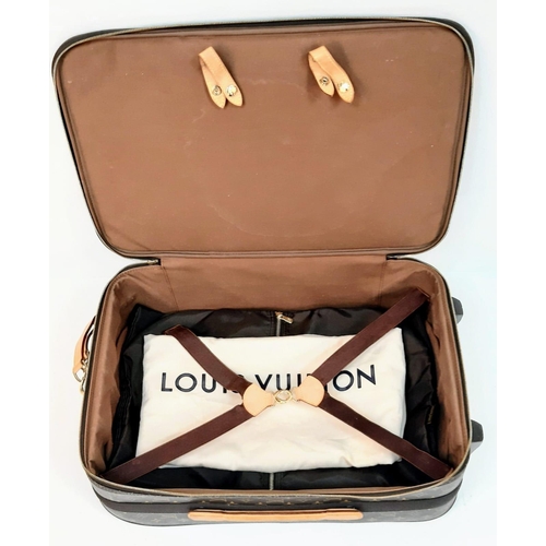 345 - Louis Vuitton Suitcase in famed LV monogrammed pattern.
Comes with Dust Cover, Lock & Key and a LV s... 