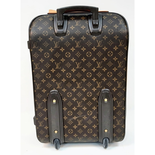 345 - Louis Vuitton Suitcase in famed LV monogrammed pattern.
Comes with Dust Cover, Lock & Key and a LV s... 