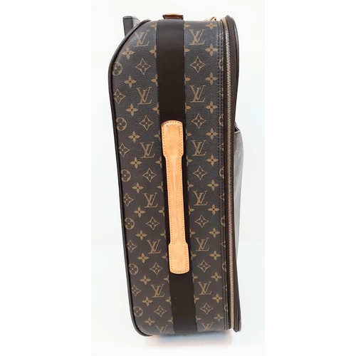 345 - Louis Vuitton Suitcase in famed LV monogrammed pattern.
Comes with Dust Cover, Lock & Key and a LV s... 