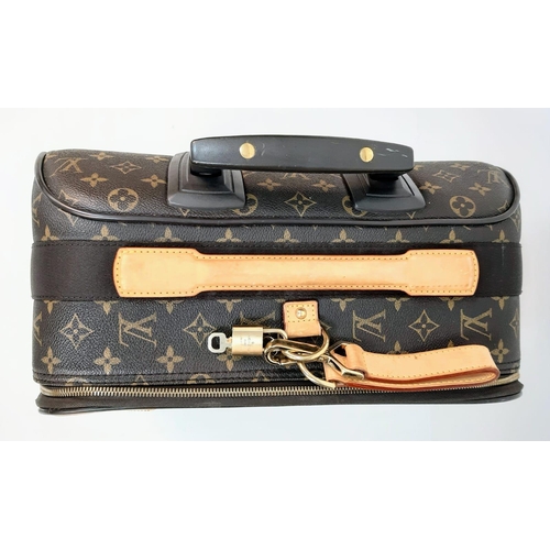 345 - Louis Vuitton Suitcase in famed LV monogrammed pattern.
Comes with Dust Cover, Lock & Key and a LV s... 