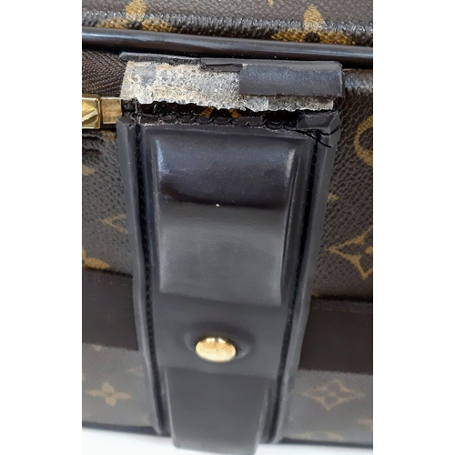 345 - Louis Vuitton Suitcase in famed LV monogrammed pattern.
Comes with Dust Cover, Lock & Key and a LV s... 