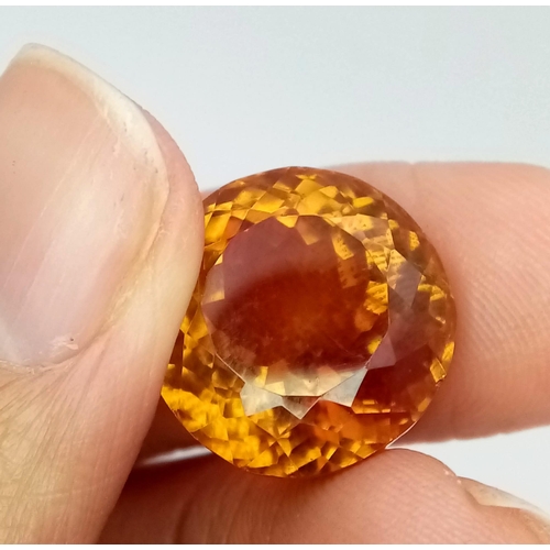 413 - A 25ct Rich Cognac Coloured Zultanite Gemstone. Round faceted cut with a deep trillion base. No visi... 