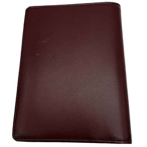 423 - Cartier Burgundy Leather Wallet.
Stylish gold toned hardware and famed CC embossed logo front. Sever... 