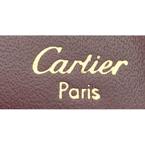 423 - Cartier Burgundy Leather Wallet.
Stylish gold toned hardware and famed CC embossed logo front. Sever... 