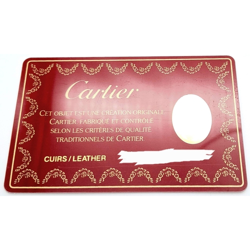 461 - Cartier Burgundy Leather Purse.
'CC' embossed logo on front with gold toned hardware. Back compartme... 