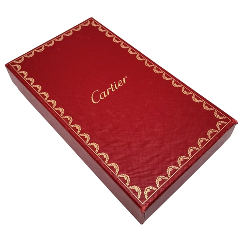 461 - Cartier Burgundy Leather Purse.
'CC' embossed logo on front with gold toned hardware. Back compartme... 