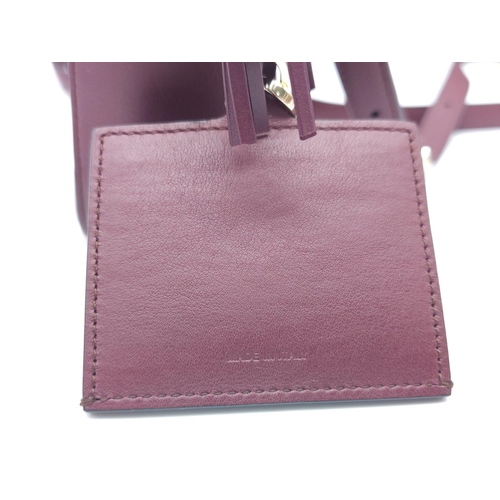 468 - Salvatore Ferragamo Leather Burgundy Shoulder Bag.
Comes with tasselled and woven vanity mirror with... 