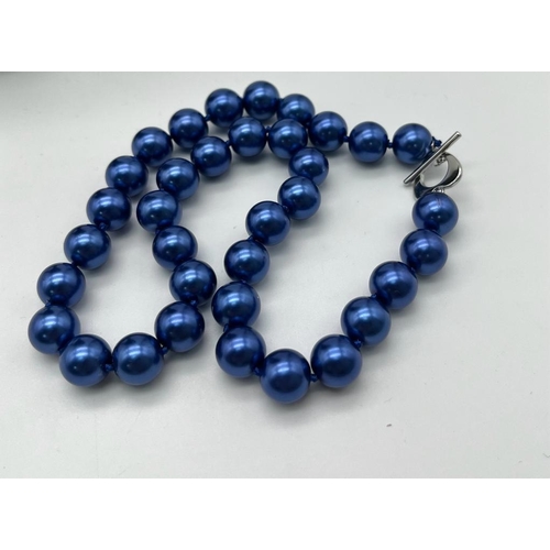 471 - A Metallic Electric Blue South Sea Pearl Shell Bead Necklace. 12mm beads. Heart clasp. 44cm necklace... 