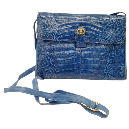 52 - Gucci Blue Crocodile Handbag.
Gold tone hardware throughout with soft quality leather. Multiple comp... 