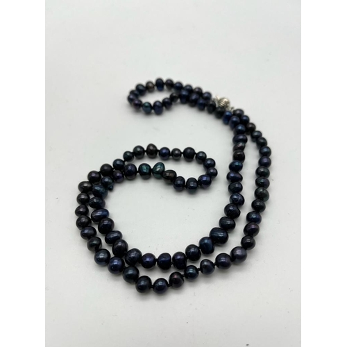 625 - A Black Akoya Cultured Freshwater Pearl Necklace. 5/6mm pearls. 68cm length.