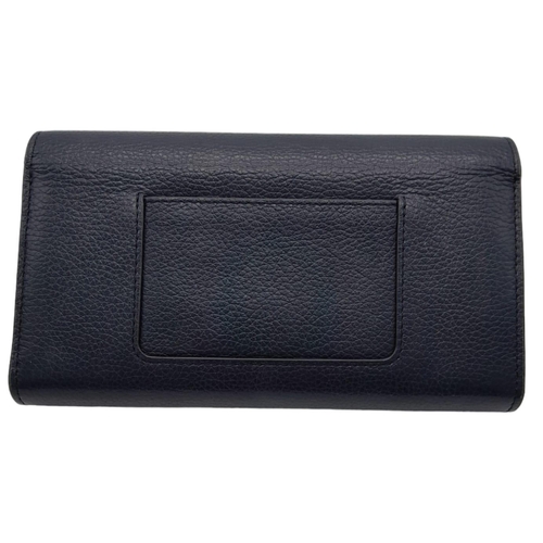 640 - Mulberry Darley Wallet.
Dark blue in colour with quality soft leather throughout. Gold tone hardware... 