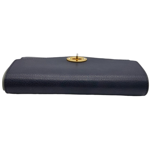 640 - Mulberry Darley Wallet.
Dark blue in colour with quality soft leather throughout. Gold tone hardware... 