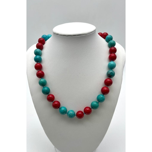 704 - A Gorgeous Turquoise and Red Coral Bead Necklace. 12mm beads. 44cm necklace length.