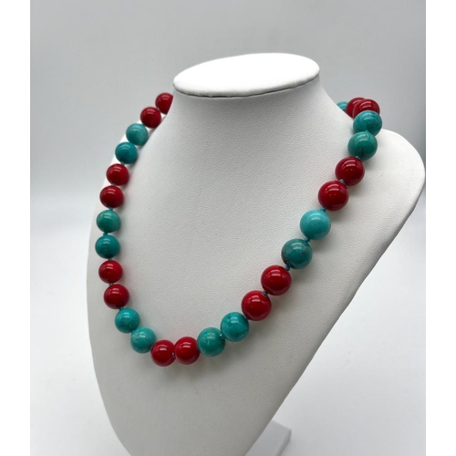 704 - A Gorgeous Turquoise and Red Coral Bead Necklace. 12mm beads. 44cm necklace length.