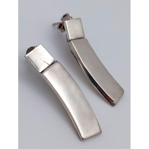 1076 - A PAIR OF DESIGNER SILVER EARRINGS .   10.2gms