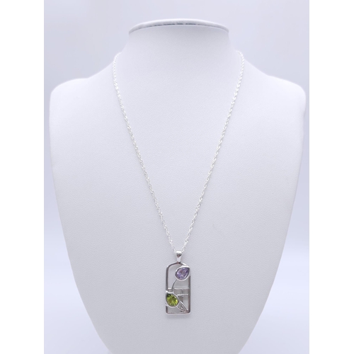 1143 - Sterling Silver, Rennie Mackintosh Design, Peridot and Amethyst Set Pendant
Necklace. 45cm Length St... 