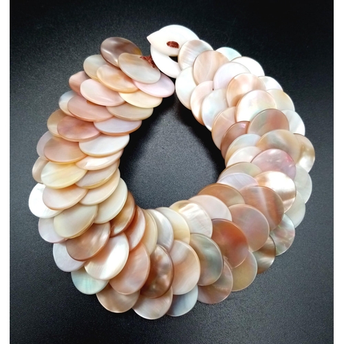 1235 - An Unworn ‘Gems of the Orient’ Mother of Pearl Bracelet. 
21cm Length. 3cm Width. Comes with Origina... 