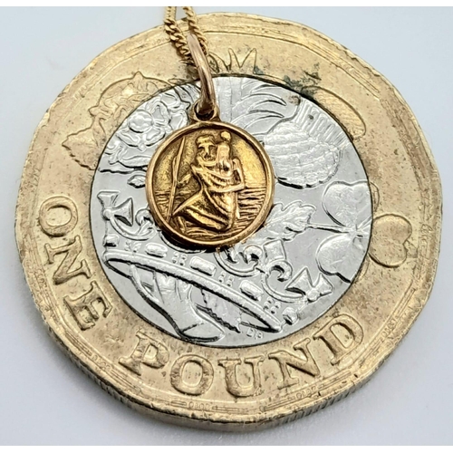 1404 - A SMALL 9K GOLD COIN ON A 40cms 9K GOLD CHAIN .   1.2gms