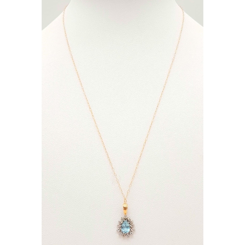 1511 - A VERY PRETTY AQUAMARINE PENDANT SET IN 9K GOLD ON A 42cms 9K GOLD CHAIN .  1.5gms