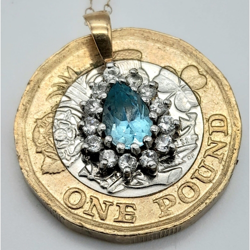 1511 - A VERY PRETTY AQUAMARINE PENDANT SET IN 9K GOLD ON A 42cms 9K GOLD CHAIN .  1.5gms