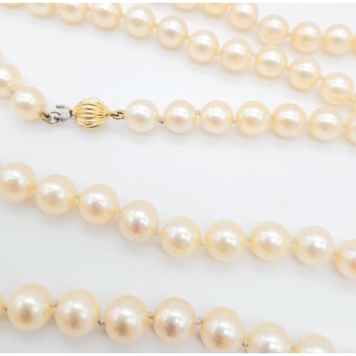 1514 - A Rope Length Golden Cultured Pearl Necklace with Two 18K Gold Clasps. 106cm length. Ref: 14844