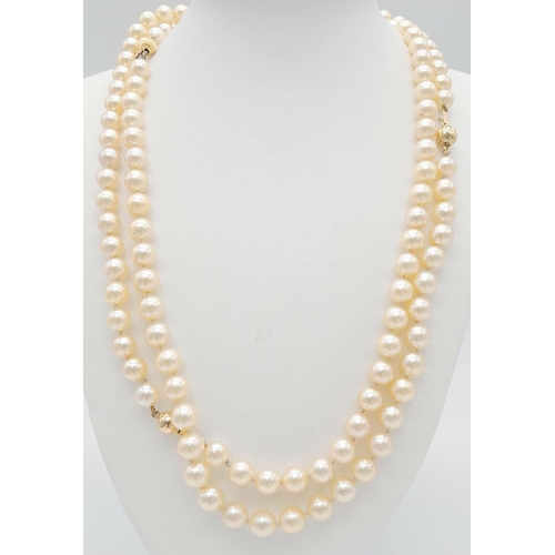 1514 - A Rope Length Golden Cultured Pearl Necklace with Two 18K Gold Clasps. 106cm length. Ref: 14844