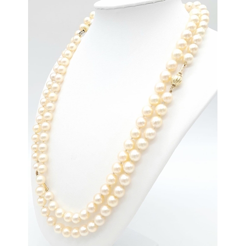 1514 - A Rope Length Golden Cultured Pearl Necklace with Two 18K Gold Clasps. 106cm length. Ref: 14844