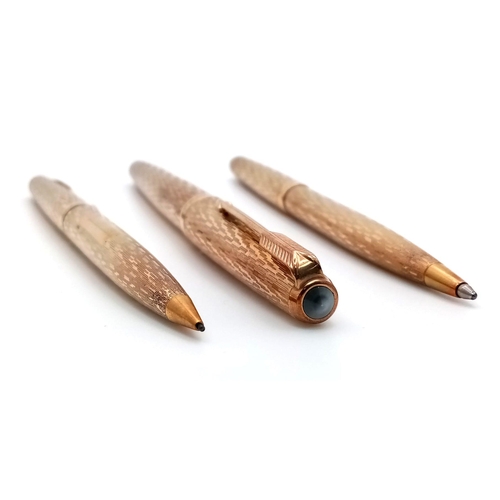 239 - A Wonderful Parker Pen 9K Gold Writing Set. Fountain, ballpoint and pencil in decorative bark-effect... 