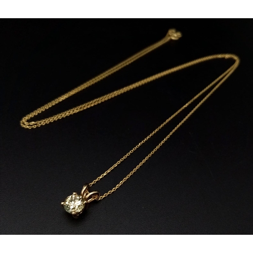 464 - An 18k Yellow Gold Diamond Solitaire Pendant on a gold plated silver chain. Round brilliant cut diam... 