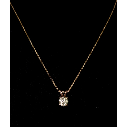 464 - An 18k Yellow Gold Diamond Solitaire Pendant on a gold plated silver chain. Round brilliant cut diam... 