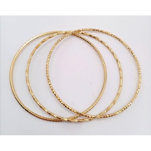 914 - An Unworn Set of Three Italian Yellow Gold Gilt Sterling Silver Stacker Bracelets. 6.6cm Inner Diame... 