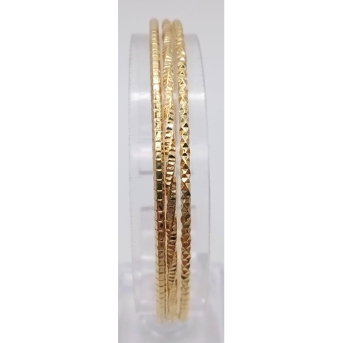 914 - An Unworn Set of Three Italian Yellow Gold Gilt Sterling Silver Stacker Bracelets. 6.6cm Inner Diame... 