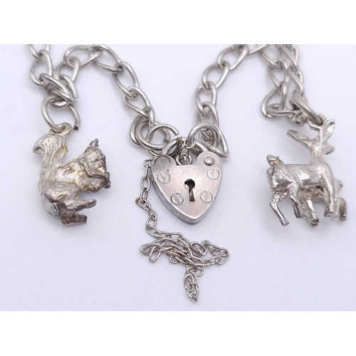 1109 - A Vintage Hallmarked 1989 Silver Charm Bracelet. 
20cm Length. Gross weight 11.84 grams.