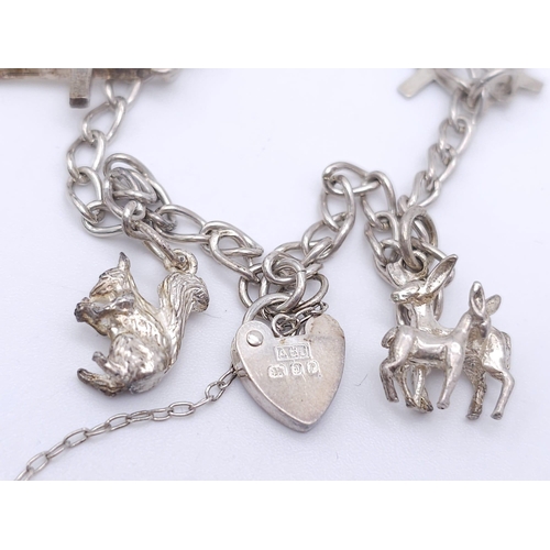 1109 - A Vintage Hallmarked 1989 Silver Charm Bracelet. 
20cm Length. Gross weight 11.84 grams.