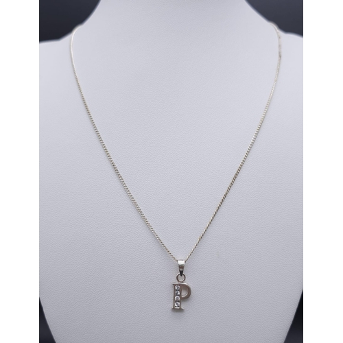 1256 - An Unworn, Ex Display, Sterling Silver, Stone Set, Letter ‘P’ Pendant Necklace. 
46cm Length Chain. ... 