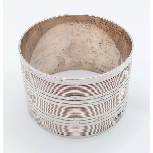 1278 - A vintage sterling silver circular J.M.H napkin holder (diameter 5cm) with full hallmarks: Birmingha... 