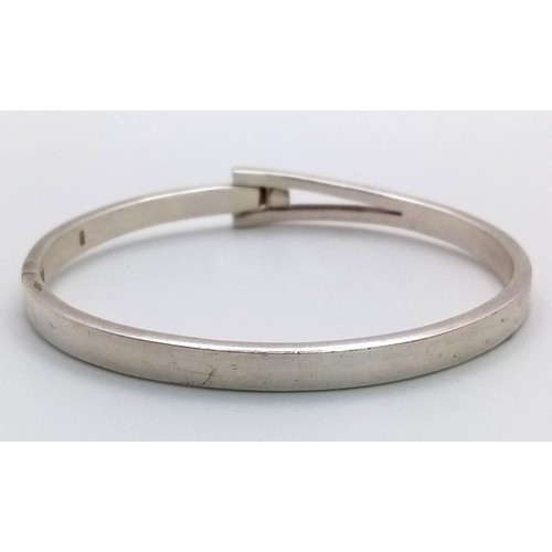 769 - A STERLING SILVER SOLID POLISHED HINGED BANGLE 26.7G
ref: SC 5070