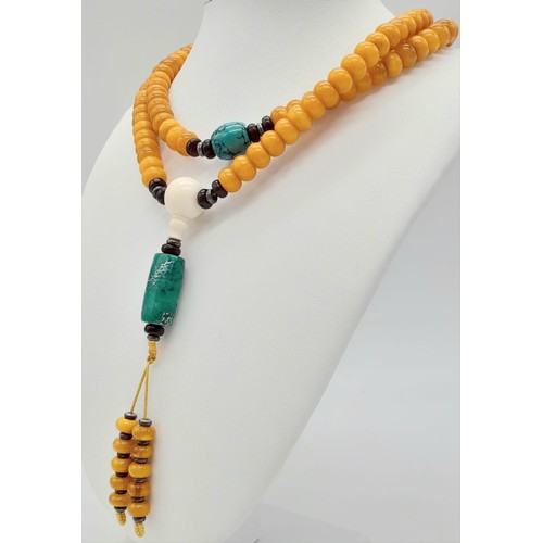 1637 - An Amber Rondelle Beaded Necklace with Turquoise Interrupters and Hanging Pendant. 74cm necklace len... 