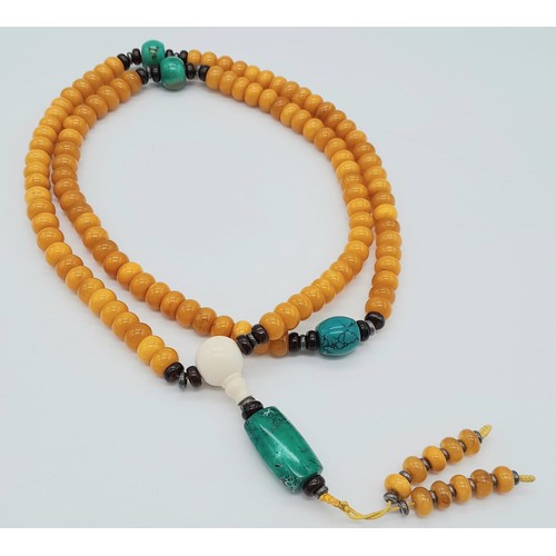 1637 - An Amber Rondelle Beaded Necklace with Turquoise Interrupters and Hanging Pendant. 74cm necklace len... 