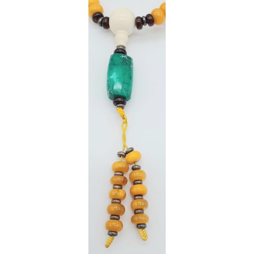 1637 - An Amber Rondelle Beaded Necklace with Turquoise Interrupters and Hanging Pendant. 74cm necklace len... 