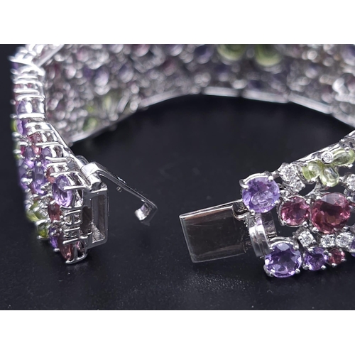 934 - A STUNNING DIAMOND AND MULTI GEMSTONE BRACELET SET IN 18K WHITE GOLD  .APPROX 17cms    52gms   01116... 