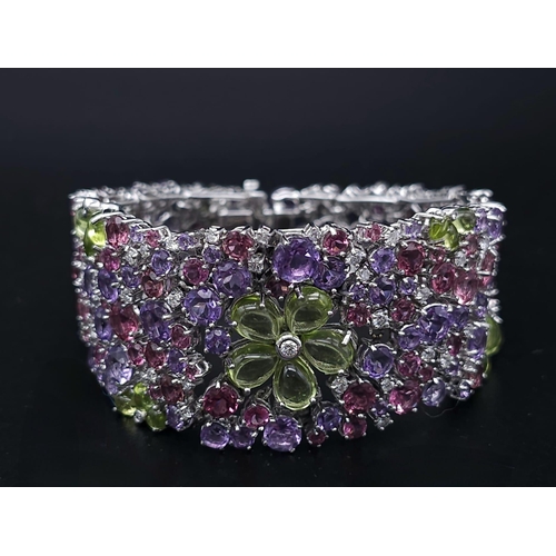 934 - A STUNNING DIAMOND AND MULTI GEMSTONE BRACELET SET IN 18K WHITE GOLD  .APPROX 17cms    52gms   01116... 