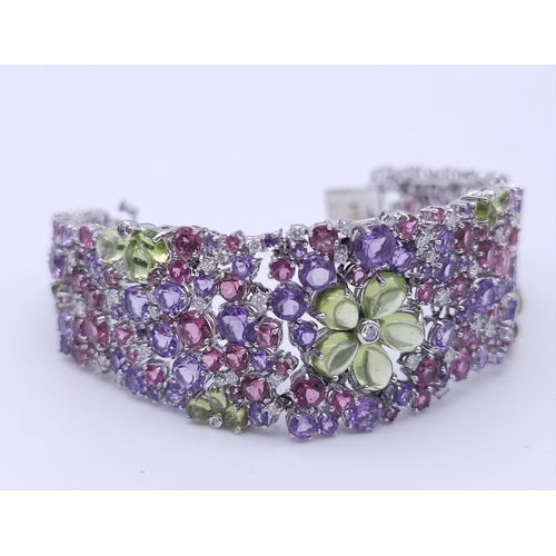 934 - A STUNNING DIAMOND AND MULTI GEMSTONE BRACELET SET IN 18K WHITE GOLD  .APPROX 17cms    52gms   01116... 