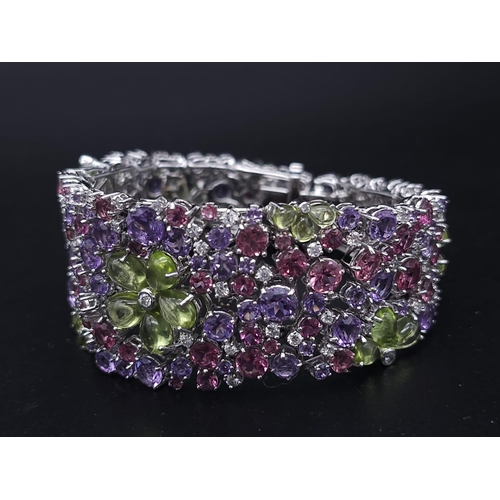 934 - A STUNNING DIAMOND AND MULTI GEMSTONE BRACELET SET IN 18K WHITE GOLD  .APPROX 17cms    52gms   01116... 