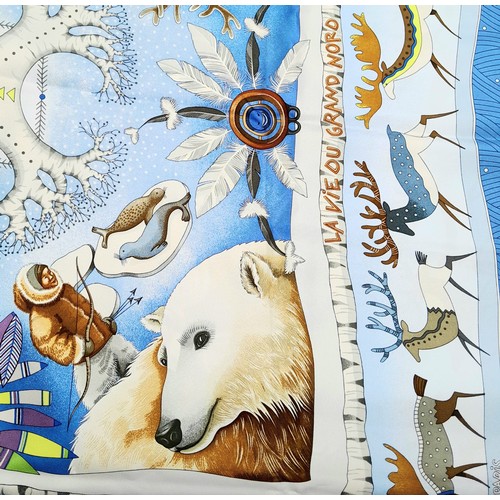 526 - An Hermes Blue 'La Vie du Grand Nord' Silk Scarf. Designed by Aline Honore. Approximately 89cm x 89c... 